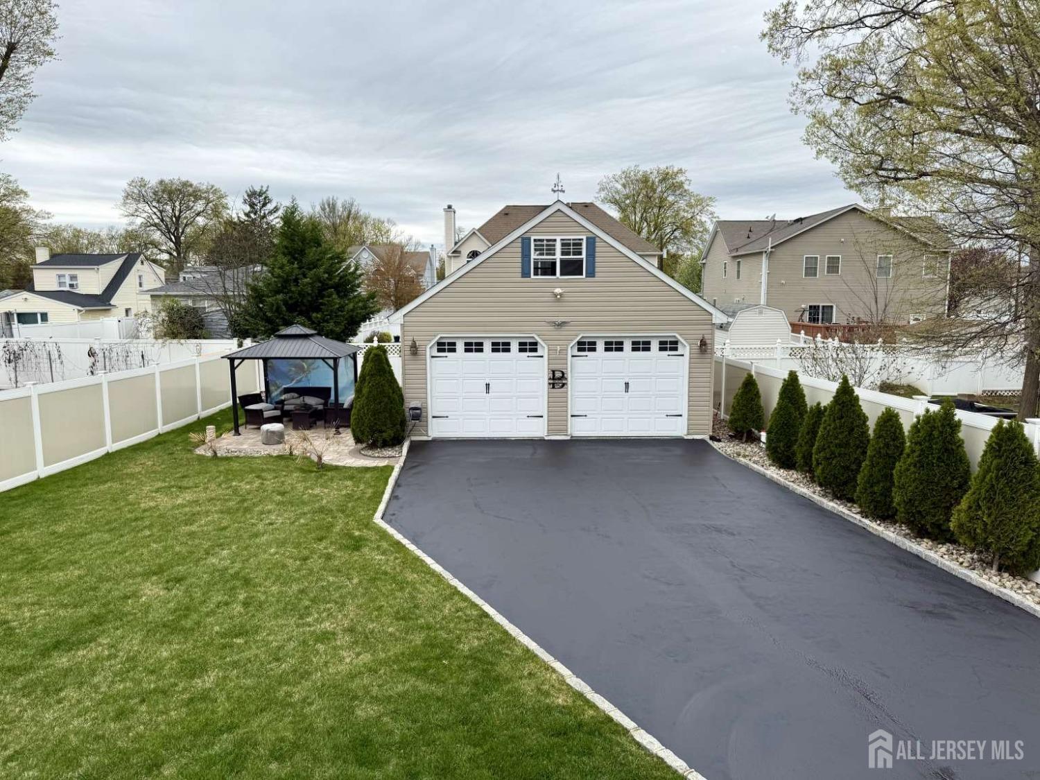 207 Remsen Avenue Avenel, NJ 07001 - Photo 21 of 24 a front view of a house with a yard