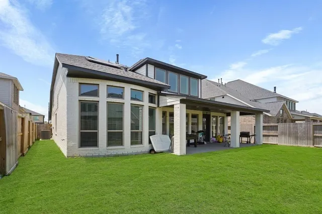 a front view of a house with a garden and porch