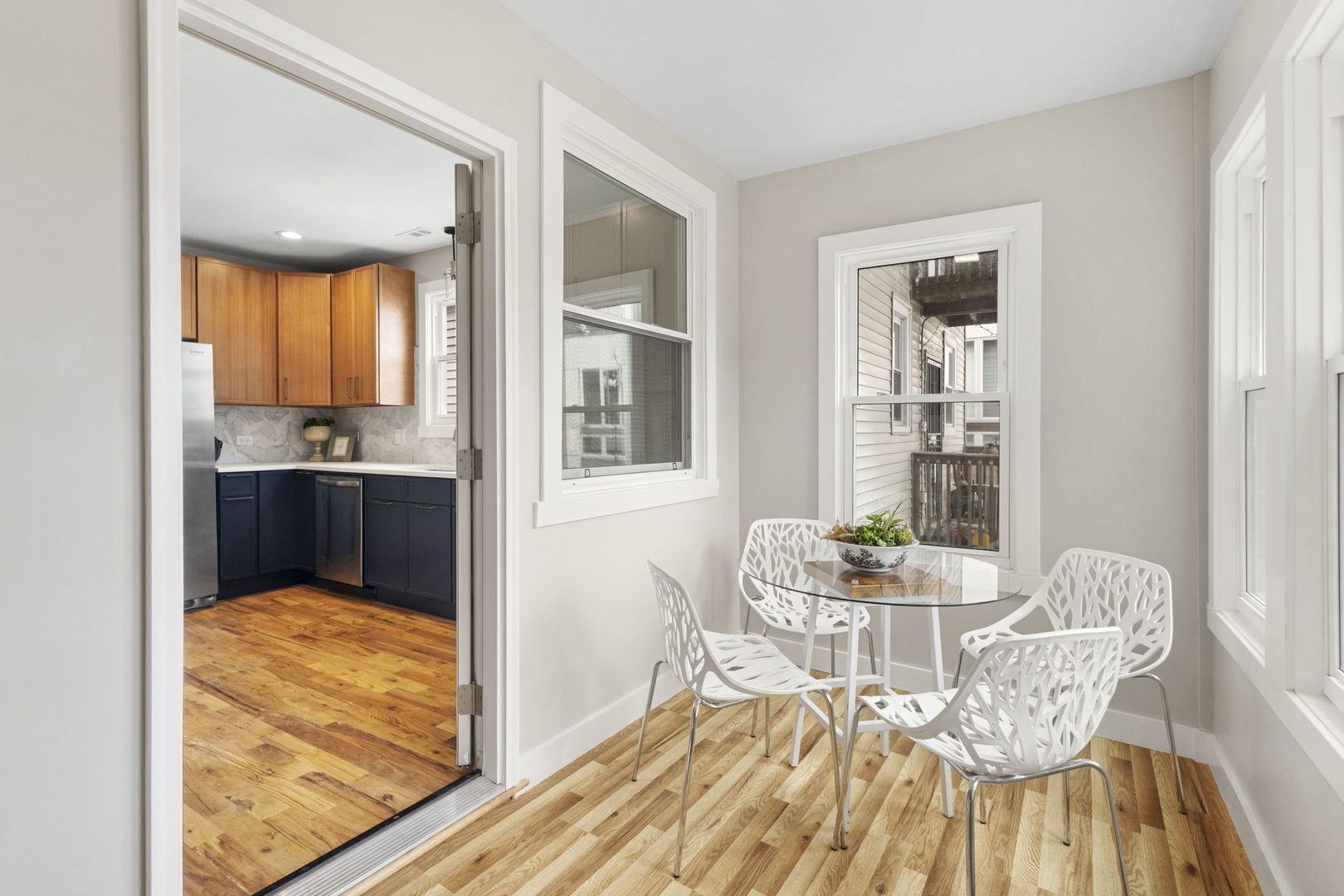 6129 North Ravenswood Avenue, Unit 1 Chicago, IL 60660 - Photo 11 of 33 a view of a dining room with furniture and wooden floor