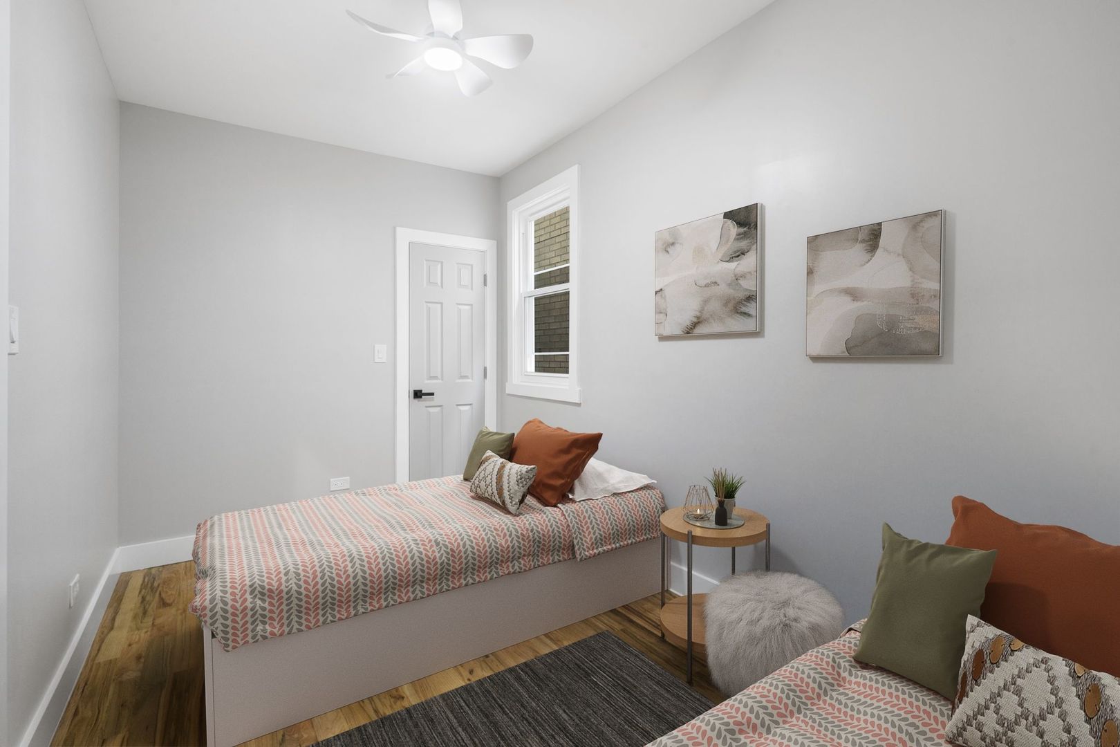 6129 North Ravenswood Avenue, Unit 1 Chicago, IL 60660 - Photo 15 of 33 a bedroom with a bed and window