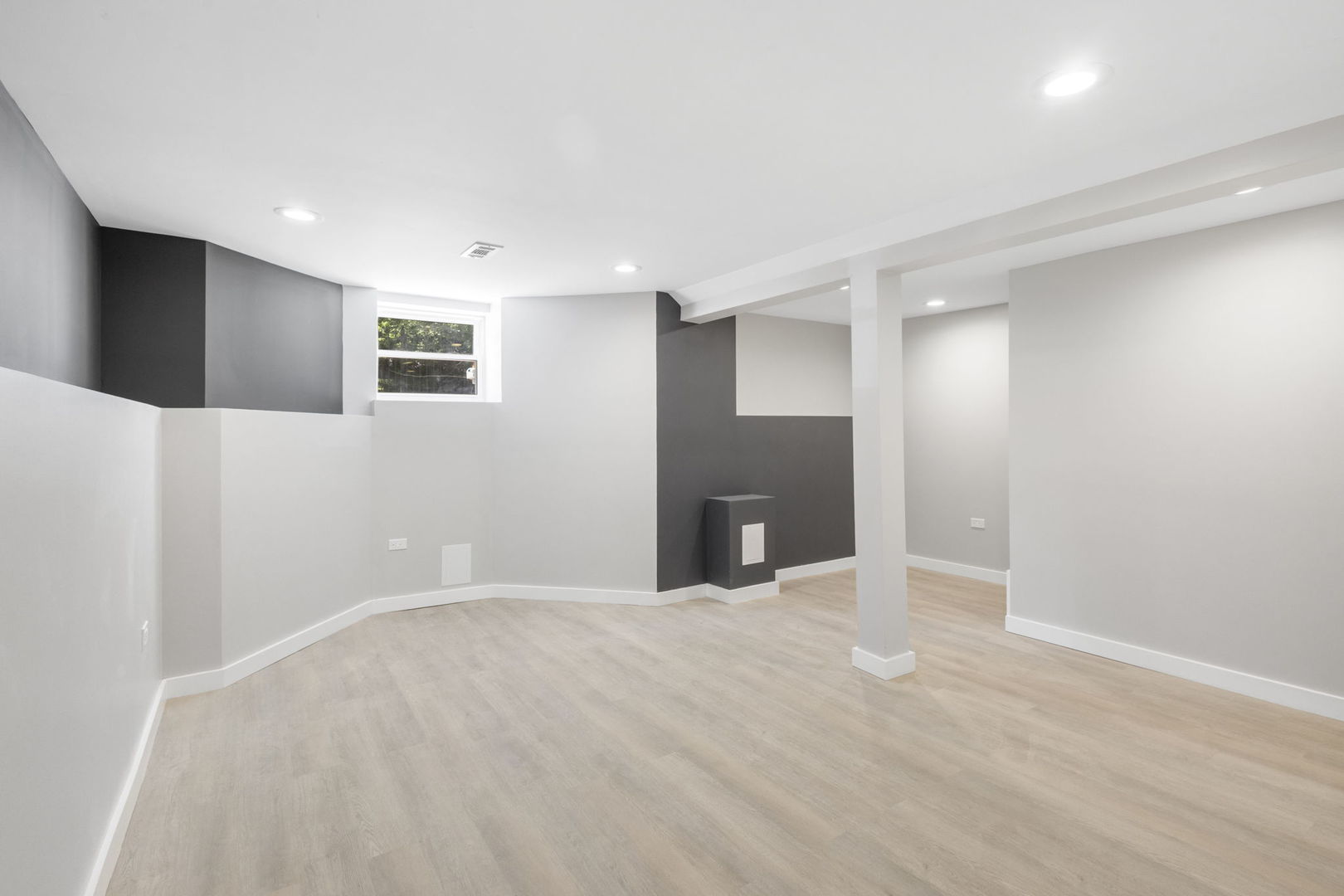 6129 North Ravenswood Avenue, Unit 1 Chicago, IL 60660 - Photo 19 of 33 a view of an empty room with kitchen and a window
