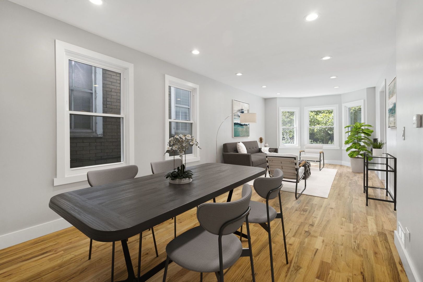 6129 North Ravenswood Avenue, Unit 1 Chicago, IL 60660 - Photo 2 of 33 a view of a dining room with furniture and wooden floor