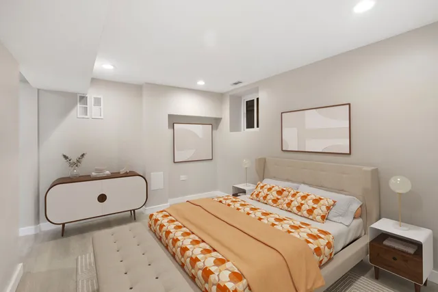 a bedroom with a bed and a couch