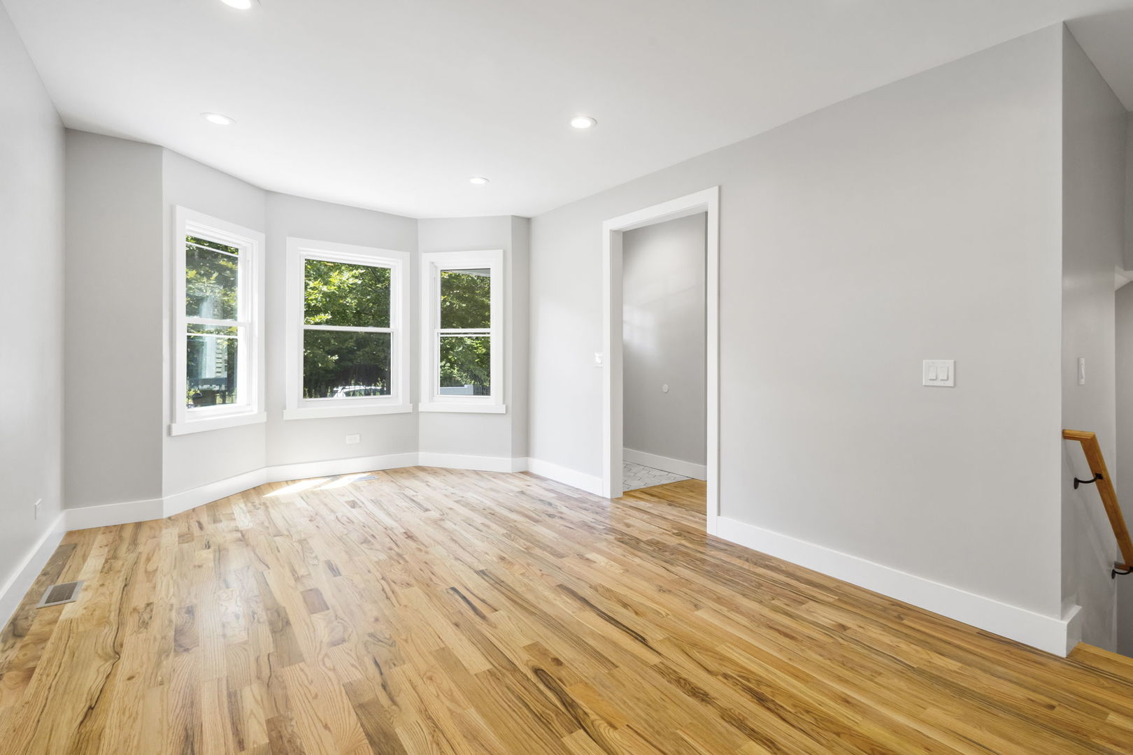 6129 North Ravenswood Avenue, Unit 1 Chicago, IL 60660 - Photo 5 of 33 a view of empty room with wooden floor and fan