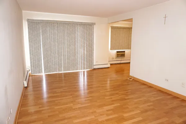 a view of a livingroom with wooden floor