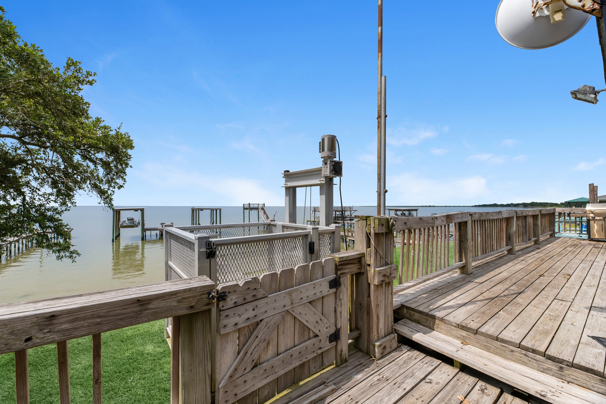 211 Captains Road Anahuac, TX 77514 - Photo 14 of 39 a view of a balcony with chairs