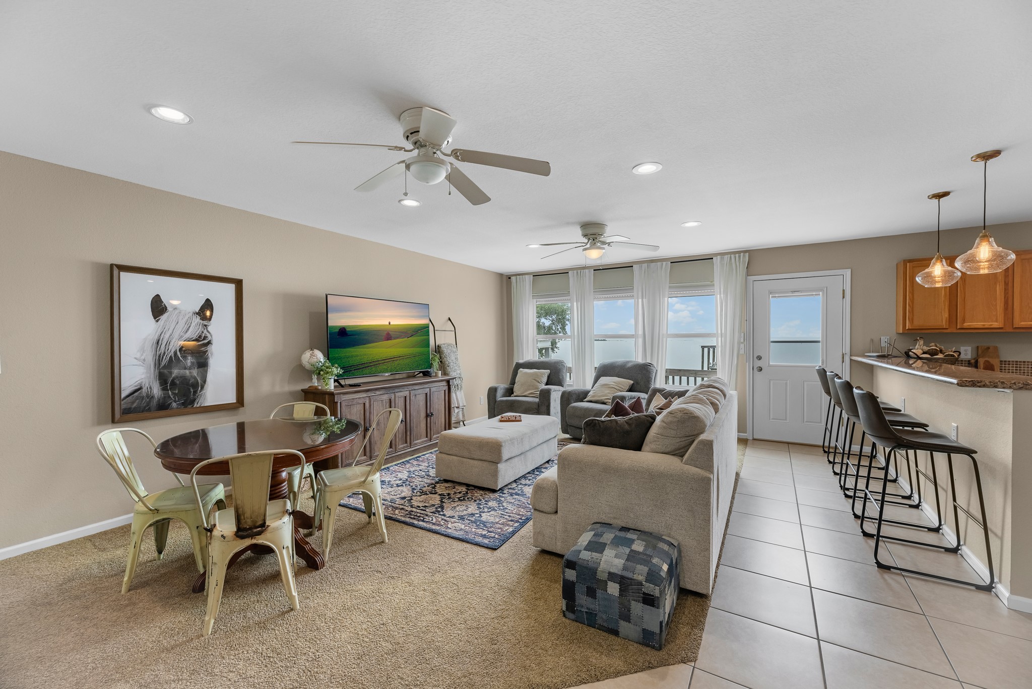 211 Captains Road Anahuac, TX 77514 - Photo 20 of 39 a living room with furniture and a flat screen tv