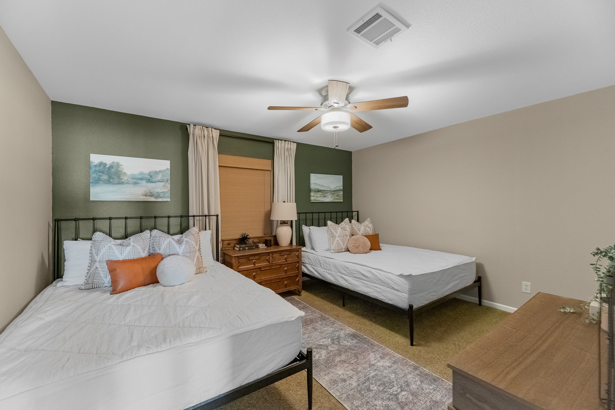 211 Captains Road Anahuac, TX 77514 - Photo 33 of 39 a bedroom with a bed and a chandelier