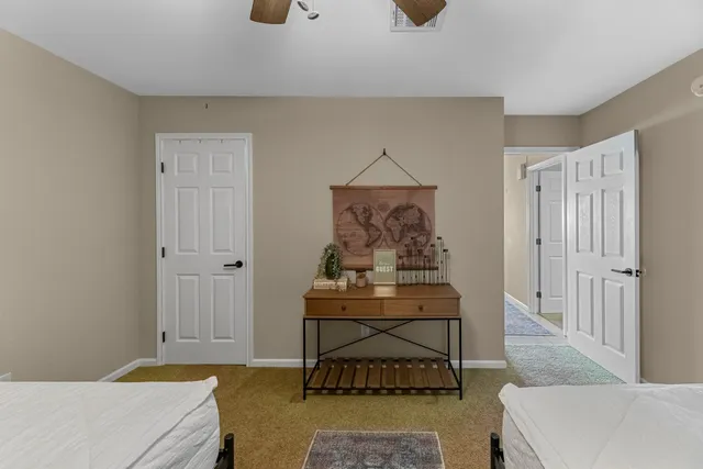 a bedroom with a bed and cabinets