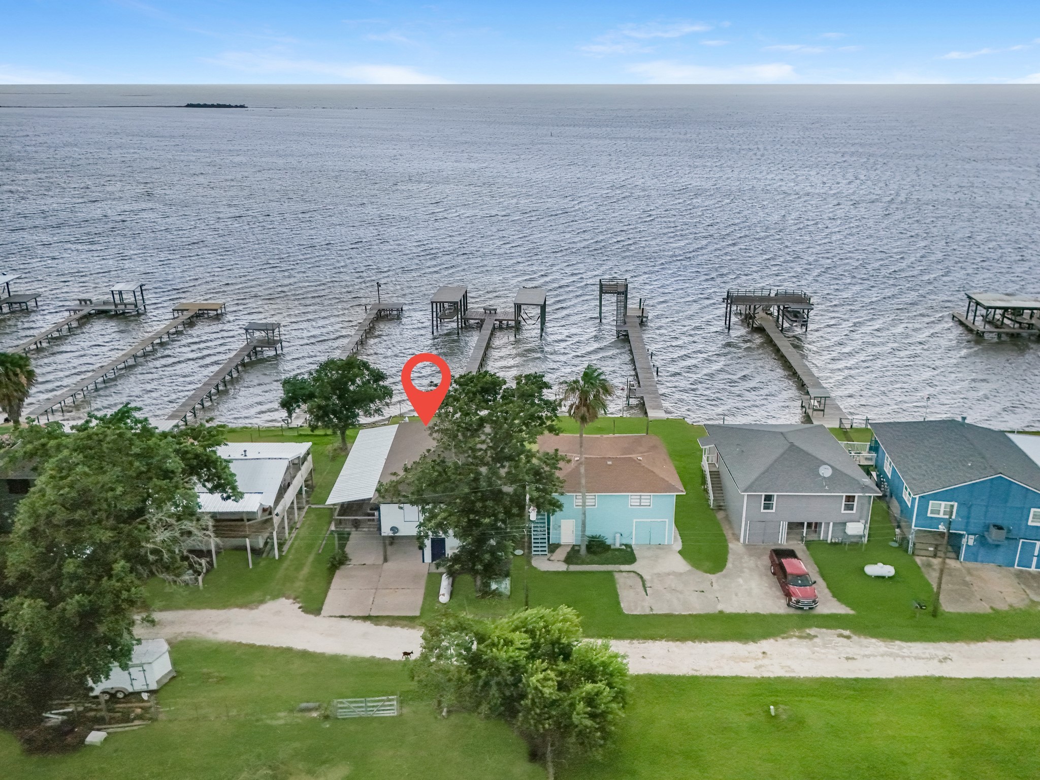 211 Captains Road Anahuac, TX 77514 - Photo 6 of 39 a aerial view of a house with a yard and potted plants