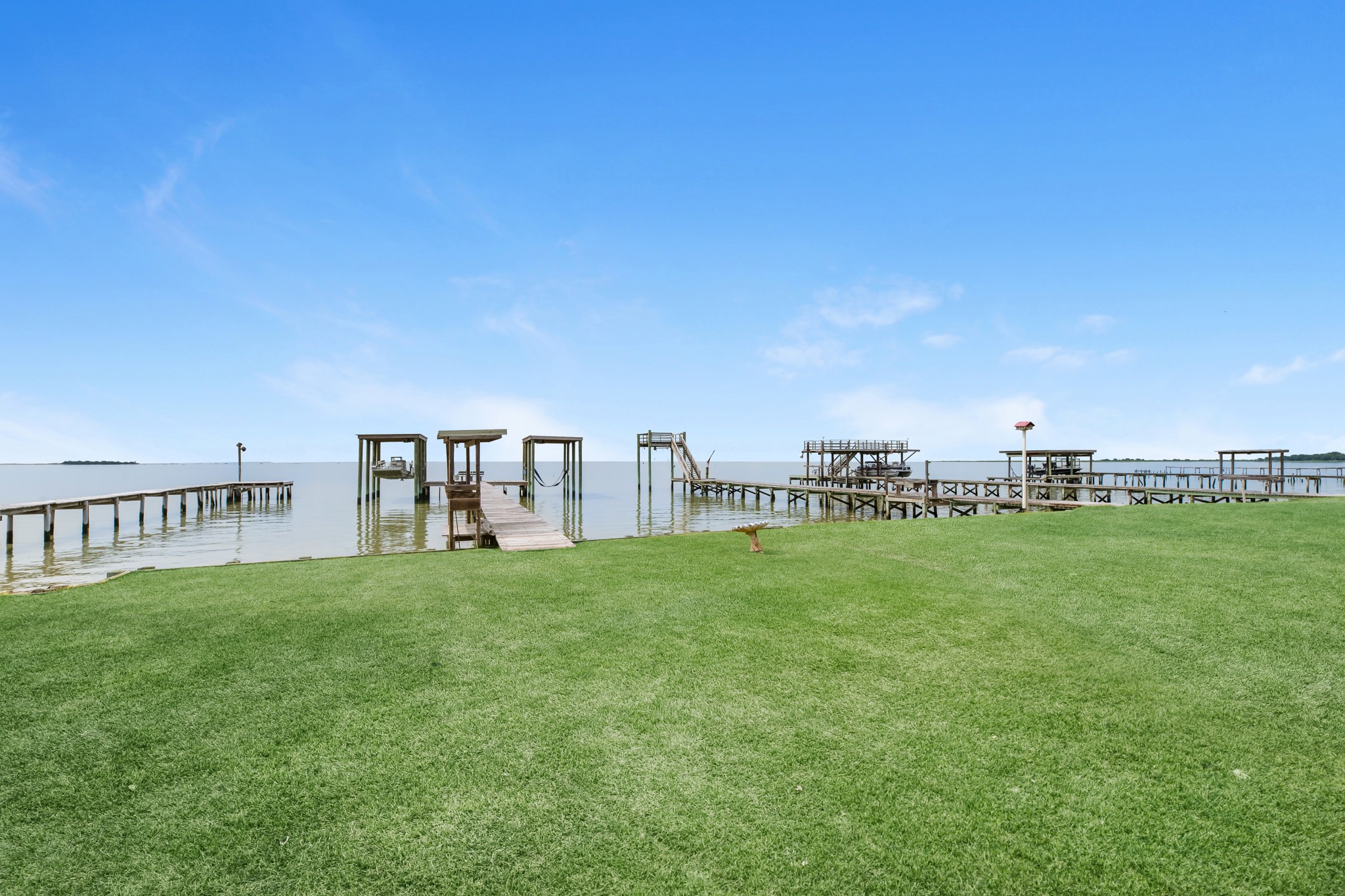 211 Captains Road Anahuac, TX 77514 - Photo 8 of 39 a view of a terrace with yard