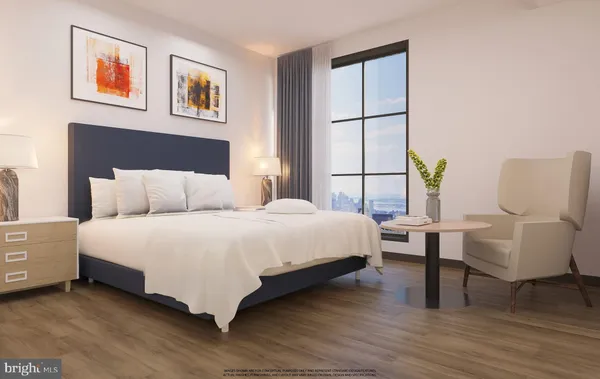 a bedroom with a bed and a couch