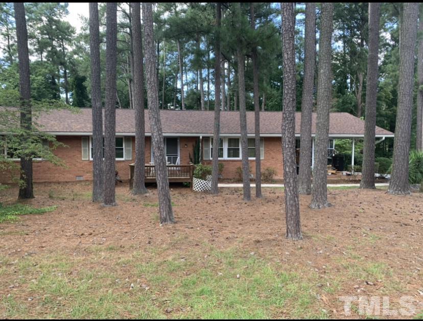 3505 Neptune Drive Raleigh, NC 27604 - Photo 2 of 28 a view of a house with backyard and a tree
