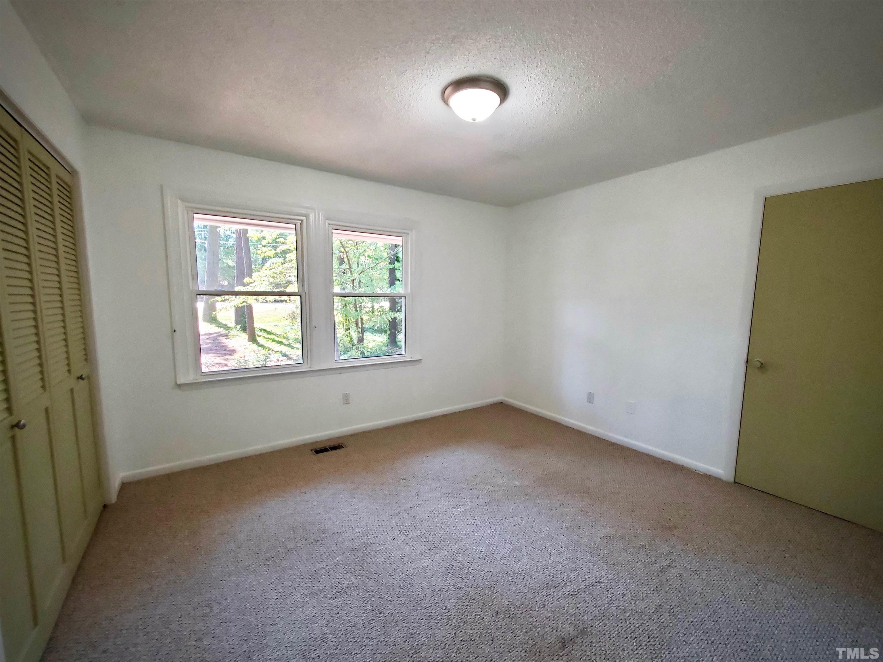 3505 Neptune Drive Raleigh, NC 27604 - Photo 16 of 28 an empty room with windows