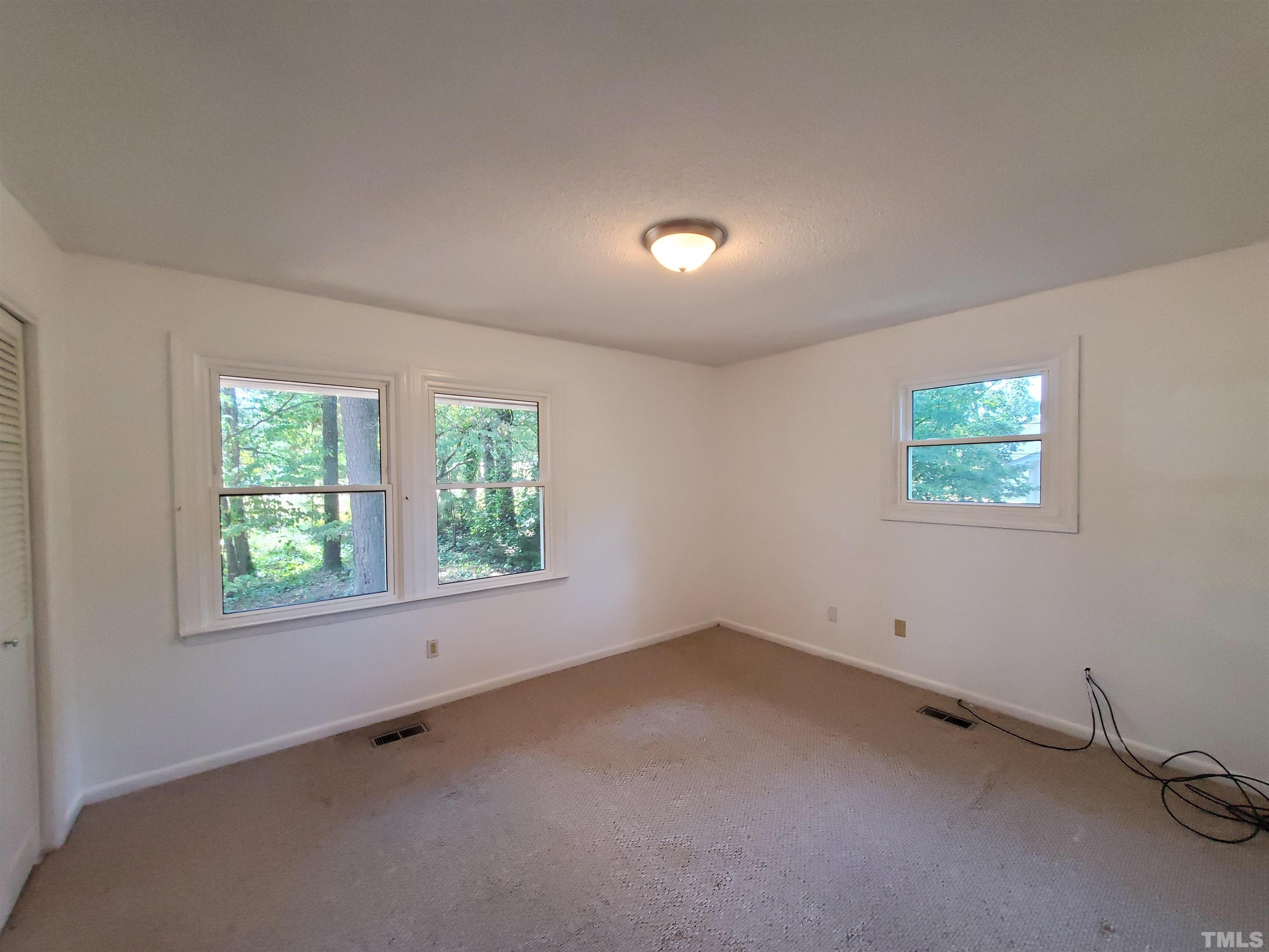 3505 Neptune Drive Raleigh, NC 27604 - Photo 17 of 28 an empty room with a window