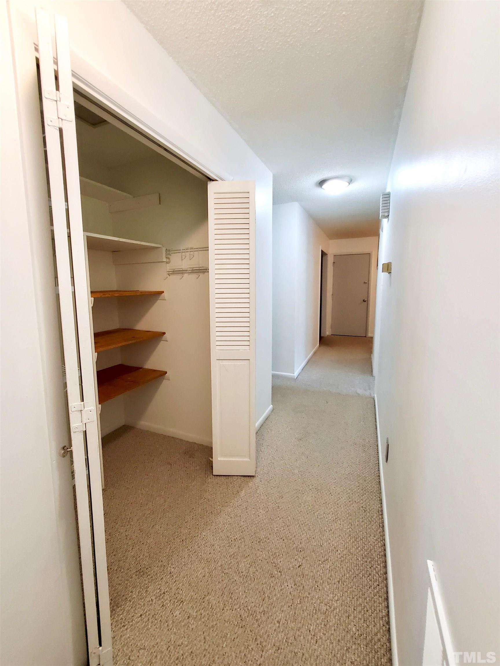 3505 Neptune Drive Raleigh, NC 27604 - Photo 18 of 28 a view of a hallway with an empty room