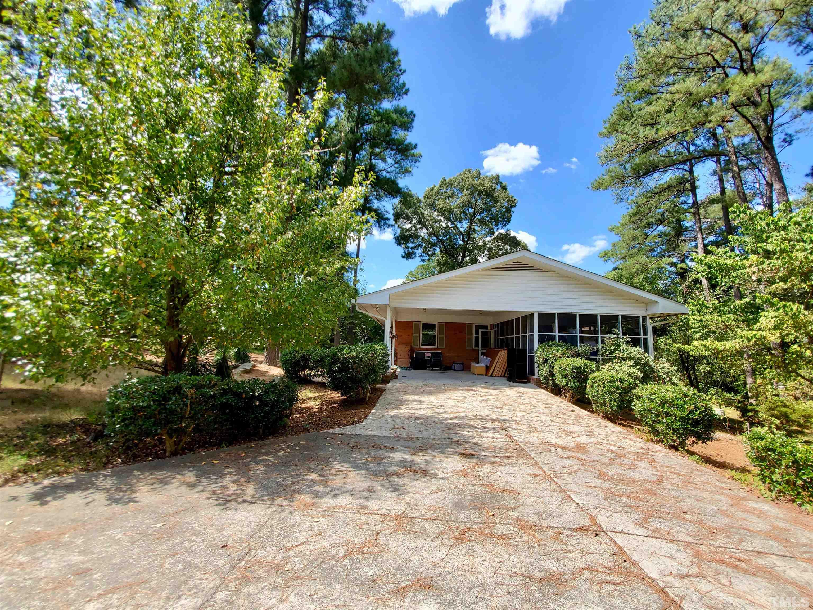 3505 Neptune Drive Raleigh, NC 27604 - Photo 19 of 28 a view of a garden with a patio