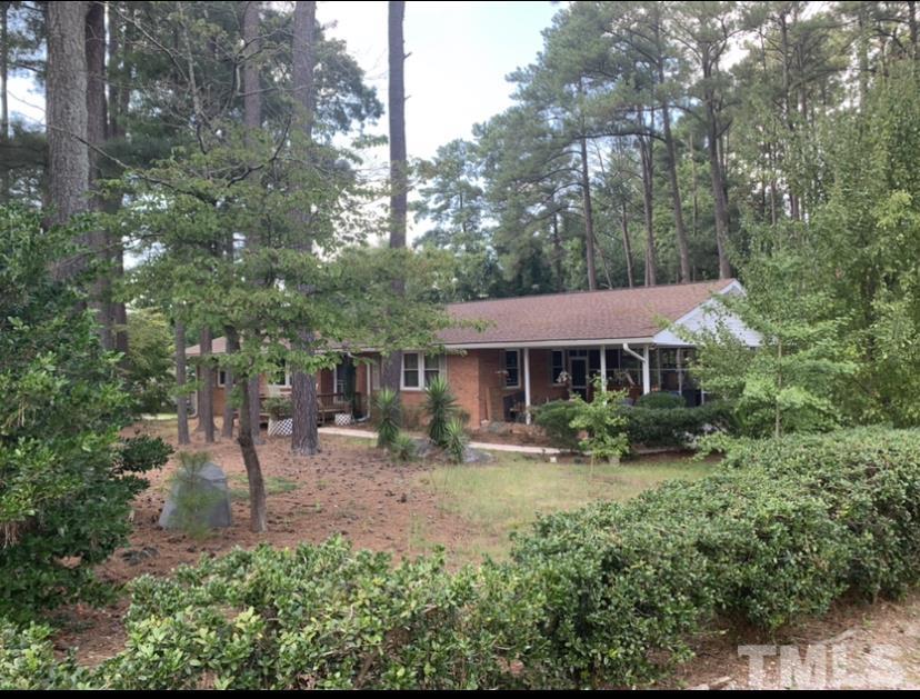 3505 Neptune Drive Raleigh, NC 27604 - Photo 3 of 28 a front view of a house with garden