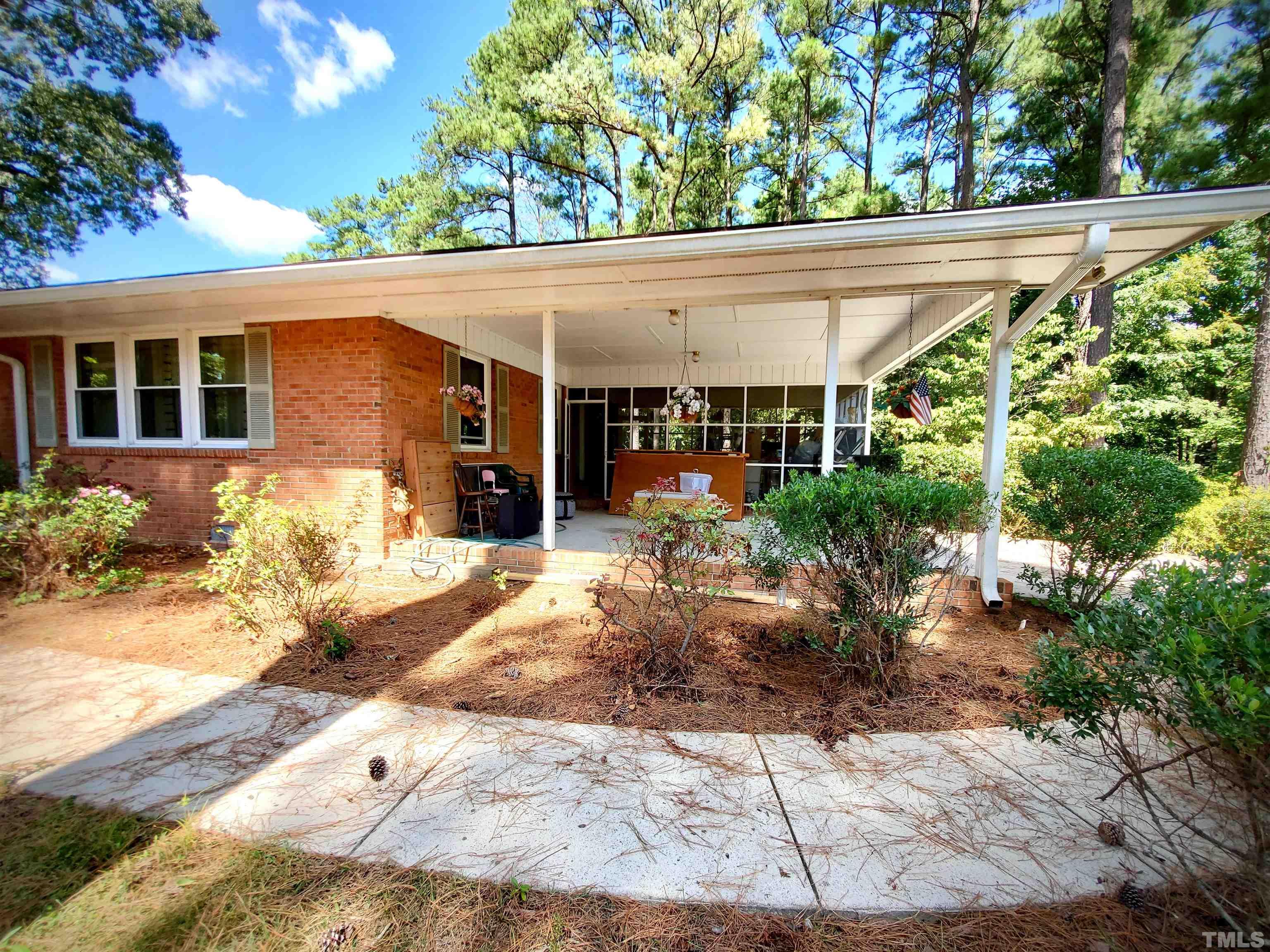 3505 Neptune Drive Raleigh, NC 27604 - Photo 25 of 28 a front view of a house with garden