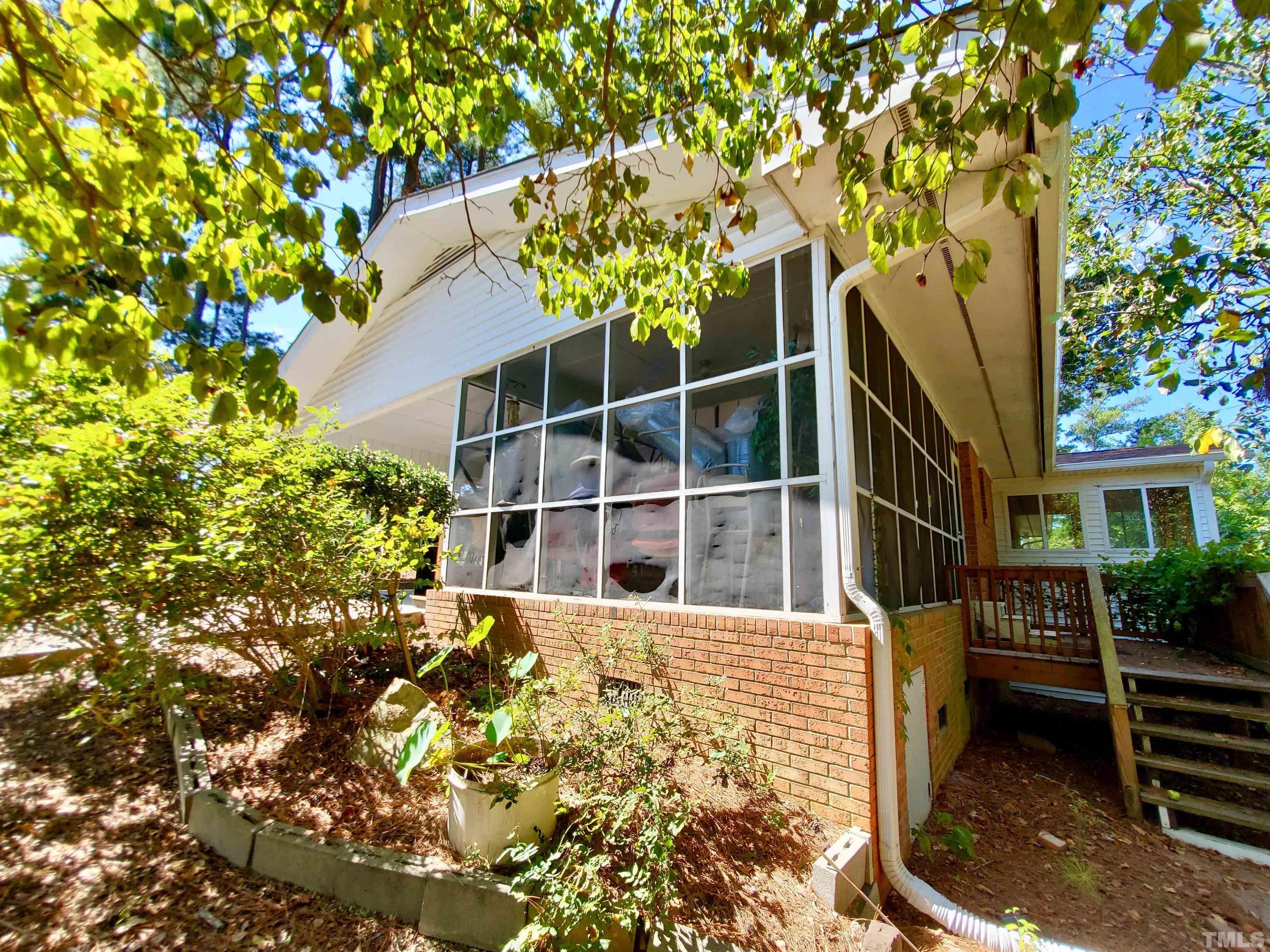 3505 Neptune Drive Raleigh, NC 27604 - Photo 28 of 28 a house with a tree in front of it