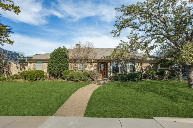 a view of a big yard next to a house