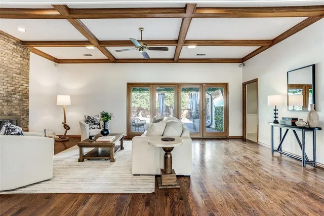 a living room with furniture and a lamp