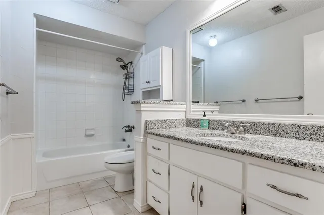 a view of a porch with furniture and a yard