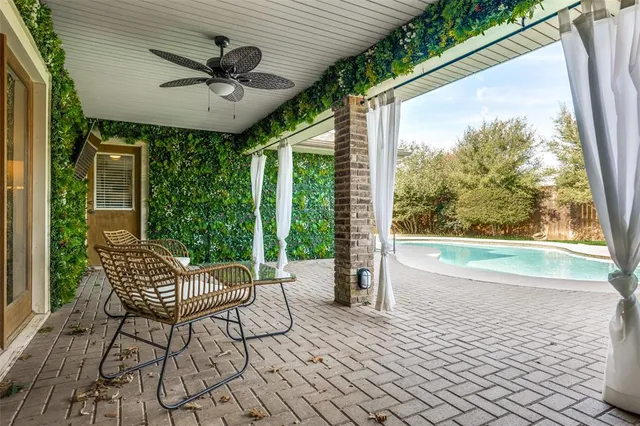 a balcony with furniture and wooden floor