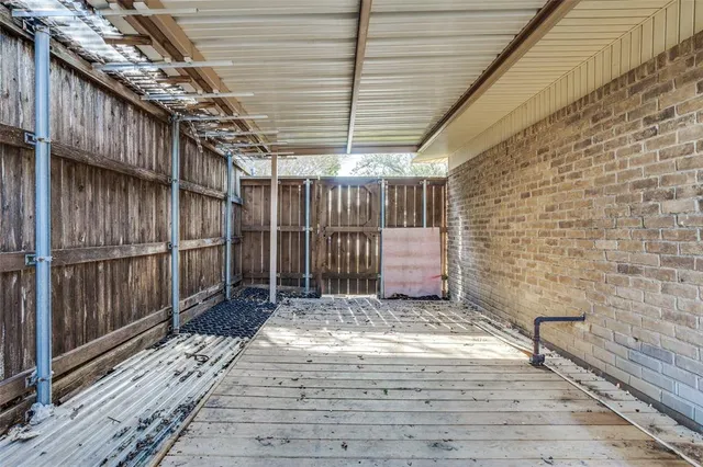 a view of a swimming pool with a sitting area