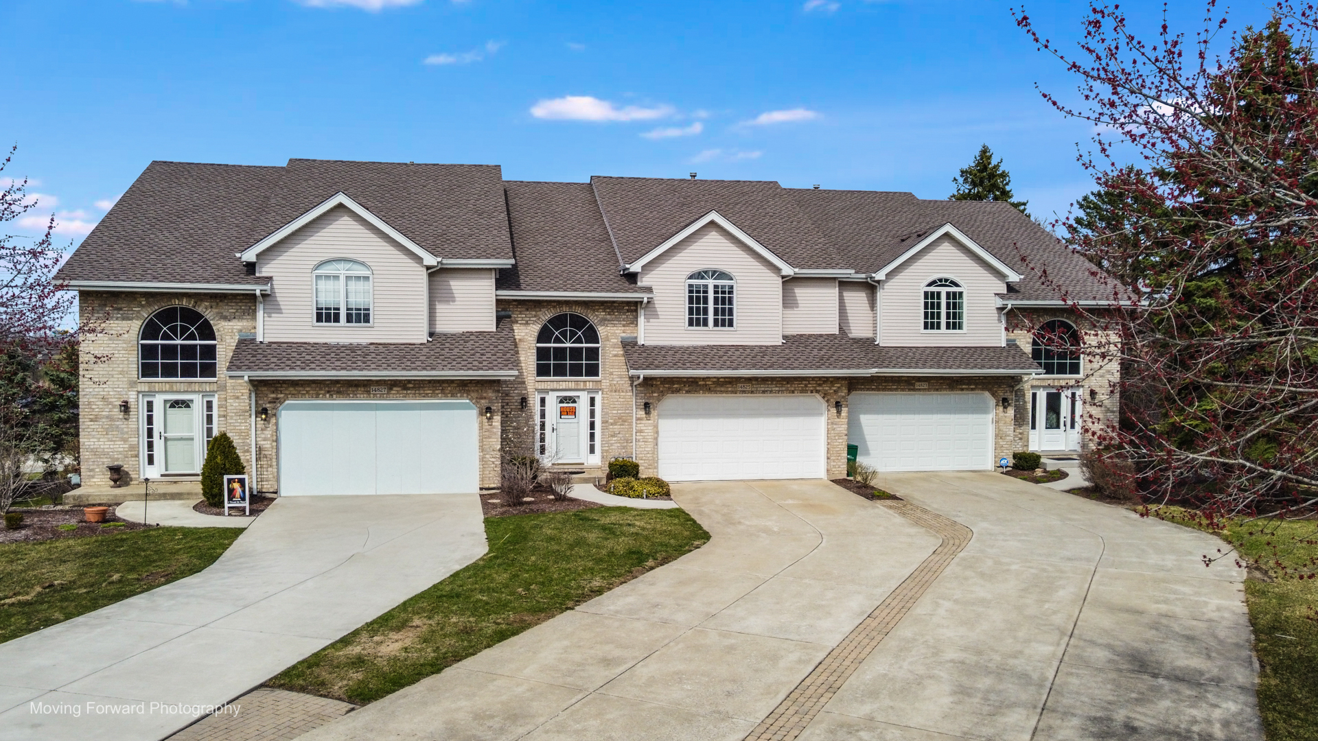 14825 Steven Court Lemont, IL 60439 - Photo 1 of 50 a front view of a house with a yard and garage