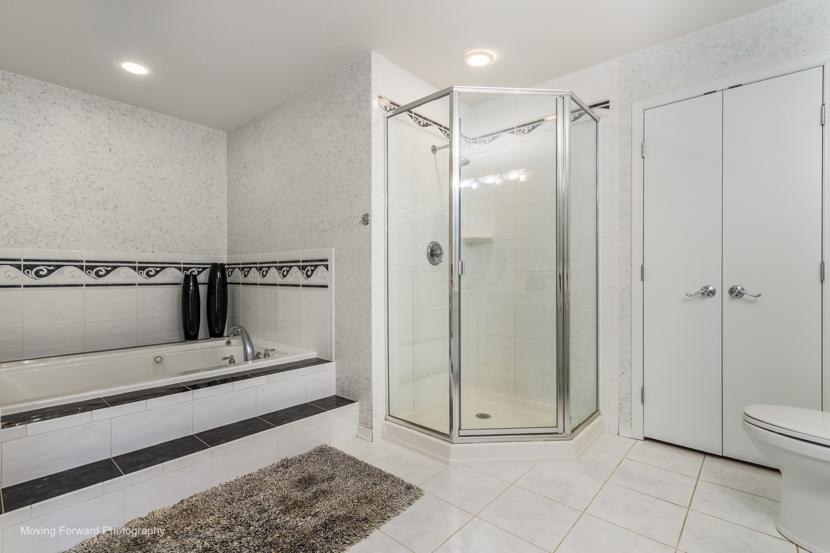 14825 Steven Court Lemont, IL 60439 - Photo 13 of 50 a bathroom with a glass shower door and a sink