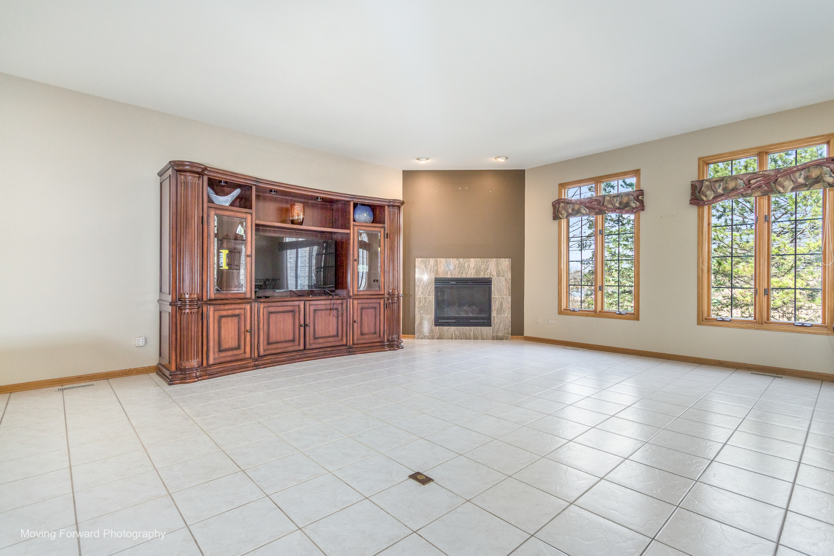 14825 Steven Court Lemont, IL 60439 - Photo 18 of 50 a view of an empty room with a fireplace and a window