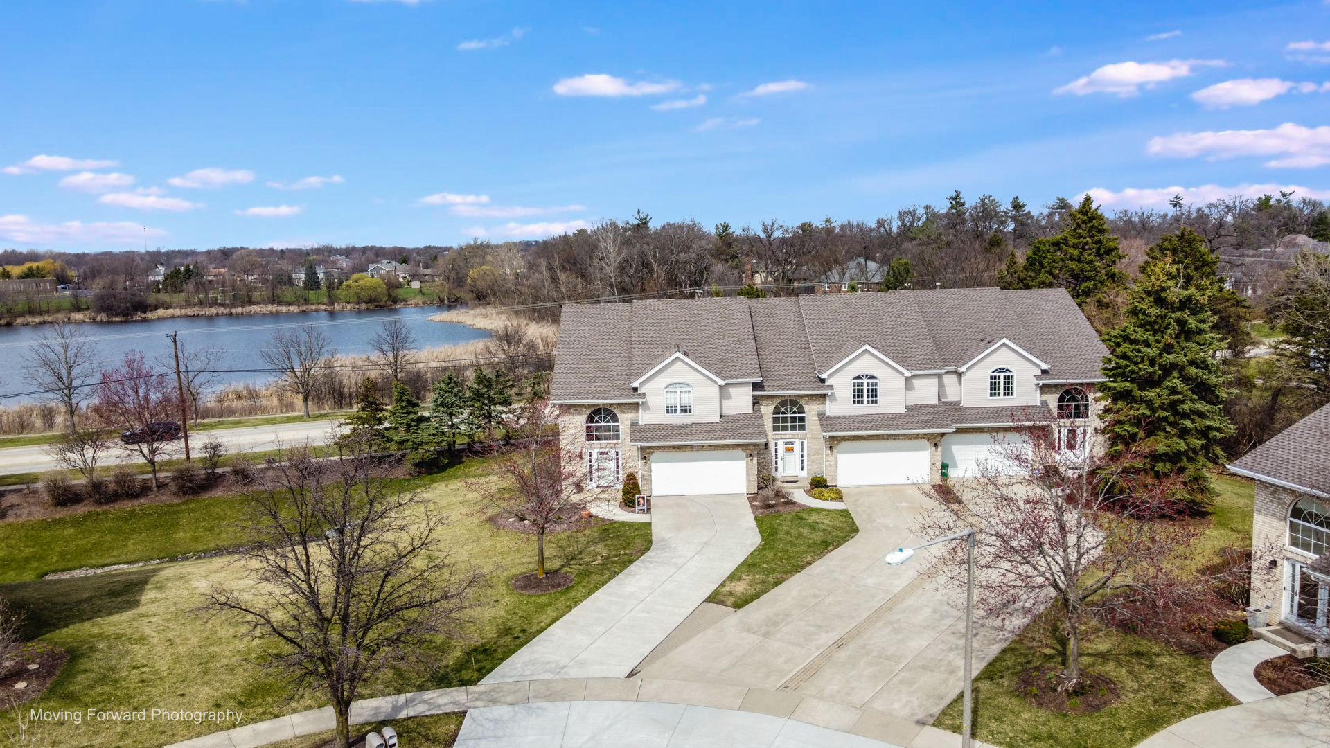14825 Steven Court Lemont, IL 60439 - Photo 2 of 50 a view of a lake with a big yard and potted plants