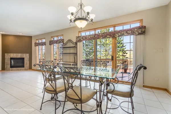a kitchen with stainless steel appliances granite countertop a refrigerator a stove and a sink