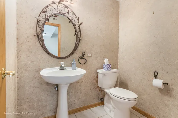 a view of a bathroom with sink and mirror