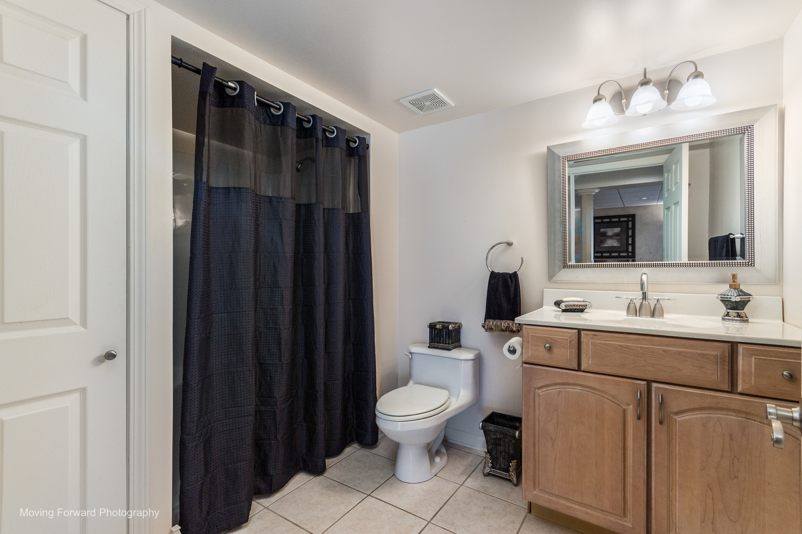 14825 Steven Court Lemont, IL 60439 - Photo 44 of 50 a bathroom with a toilet a sink and mirror