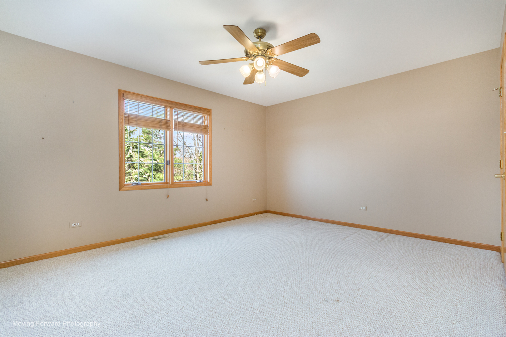 14825 Steven Court Lemont, IL 60439 - Photo 6 of 50 an empty room with a window and a ceiling fan