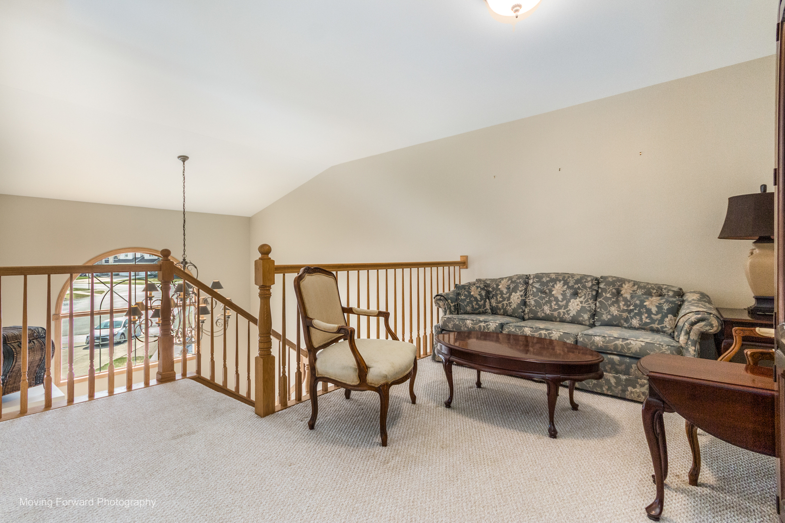 14825 Steven Court Lemont, IL 60439 - Photo 8 of 50 a balcony with furniture and a chandelier