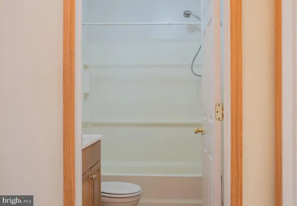a bathroom with a shower and a toilet