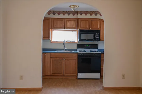 a kitchen with a stove and a microwave