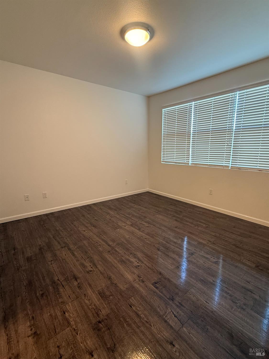 524 Blythewood Place Santa Rosa, CA 95407 - Photo 14 of 21 a view of empty room with wooden floor and fan