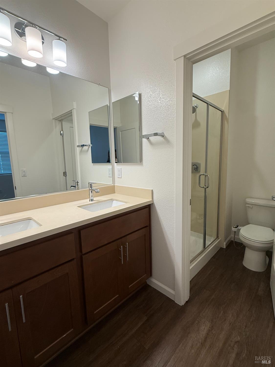 524 Blythewood Place Santa Rosa, CA 95407 - Photo 15 of 21 a bathroom with a double vanity sink toilet and shower