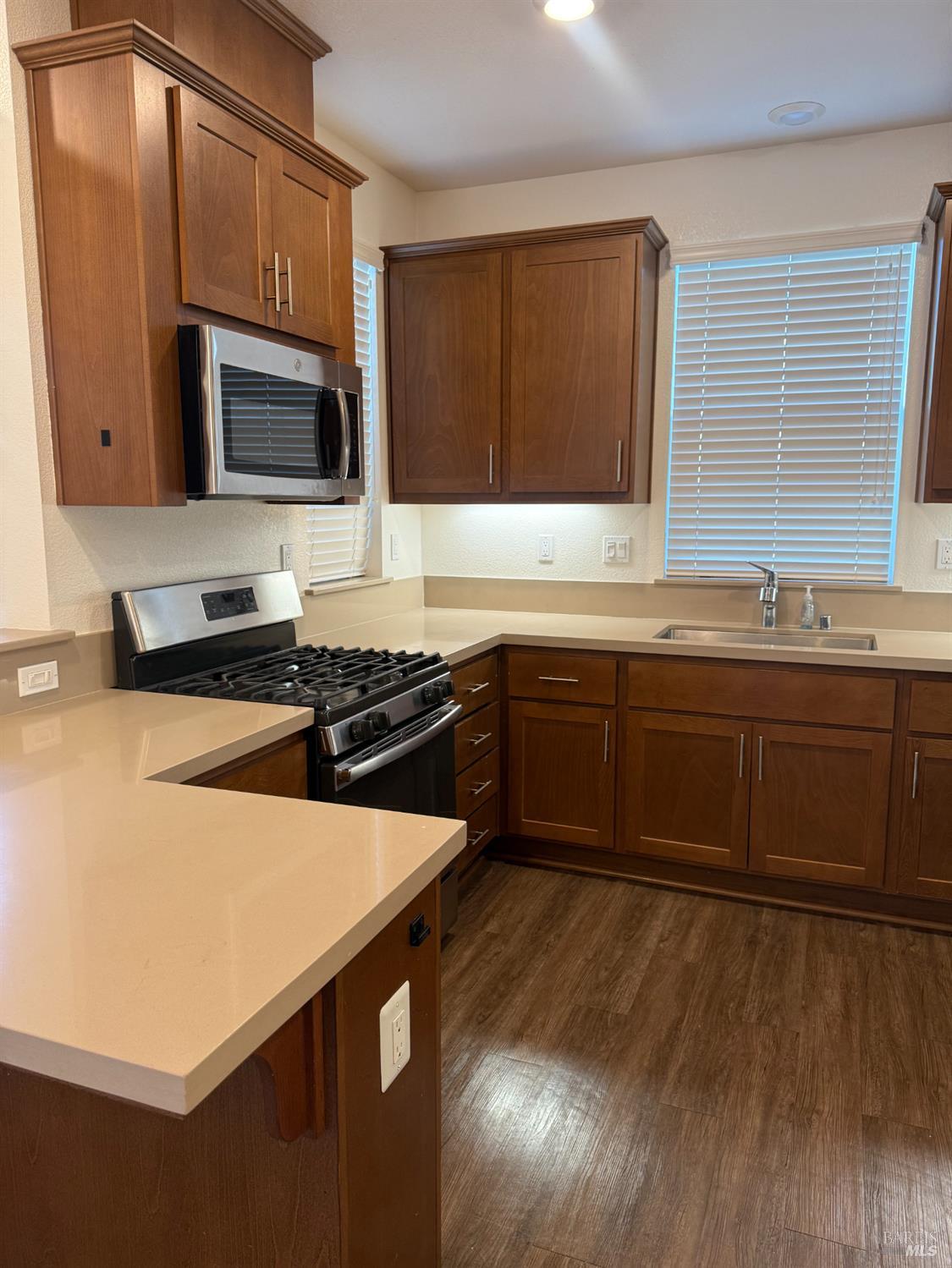 524 Blythewood Place Santa Rosa, CA 95407 - Photo 7 of 21 a kitchen with stainless steel appliances a sink a stove a microwave a sink and cabinets