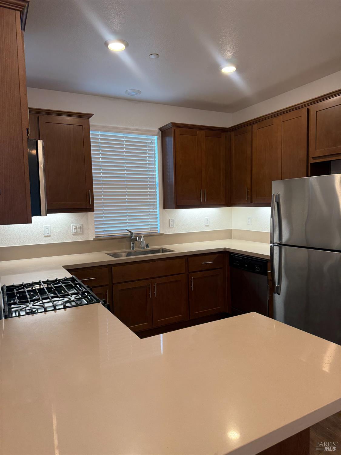 524 Blythewood Place Santa Rosa, CA 95407 - Photo 8 of 21 a kitchen with a refrigerator and a stove top oven