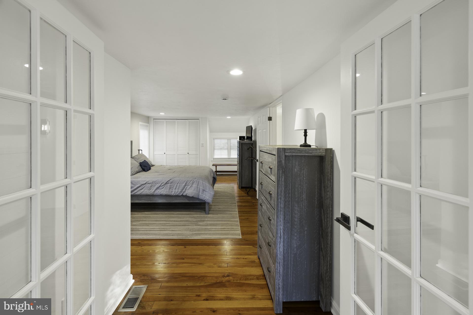 229 Boy Scout Road New Oxford, PA 17350 - Photo 20 of 73 a view of a bedroom with furniture and wooden floor