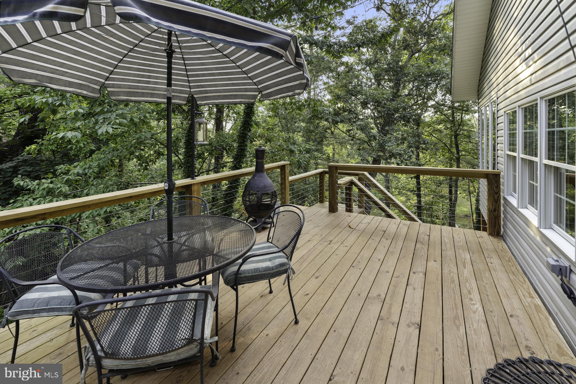229 Boy Scout Road New Oxford, PA 17350 - Photo 32 of 73 a view of balcony with wooden floor and outdoor seating