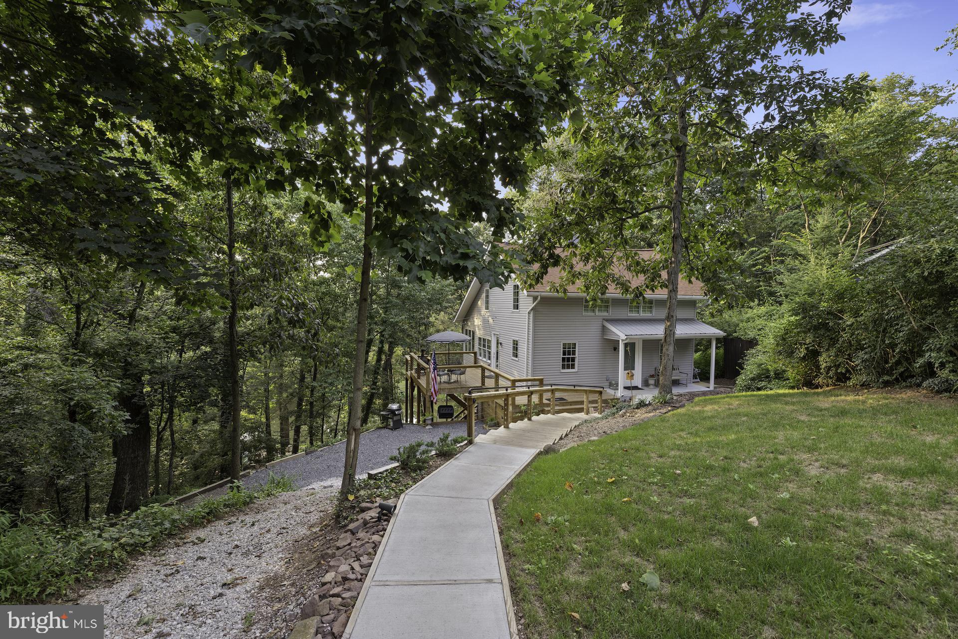 229 Boy Scout Road New Oxford, PA 17350 - Photo 41 of 73 a front view of a house with a yard and trees