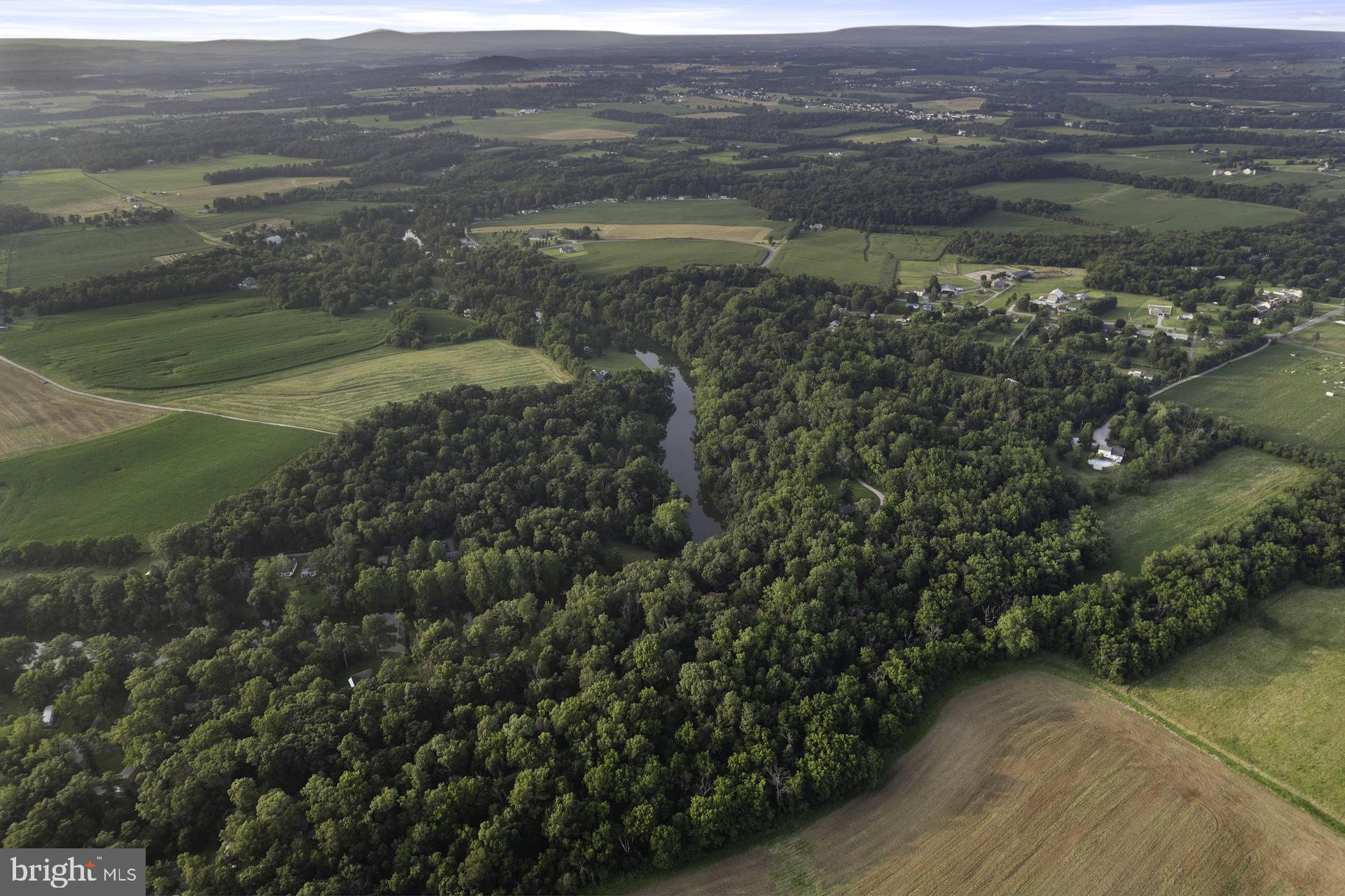 229 Boy Scout Road New Oxford, PA 17350 - Photo 70 of 73 a view of a lake with a mountain