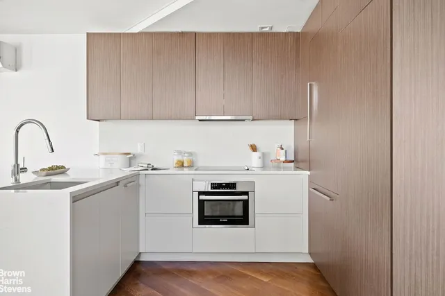 a utility room with sink dryer and washer