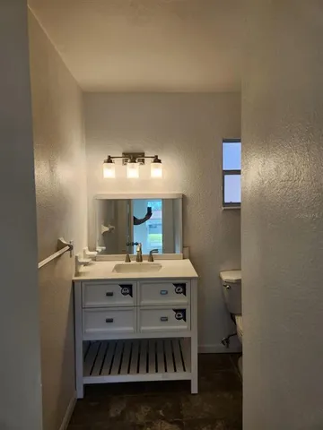 a view of a kitchen counter space and appliances